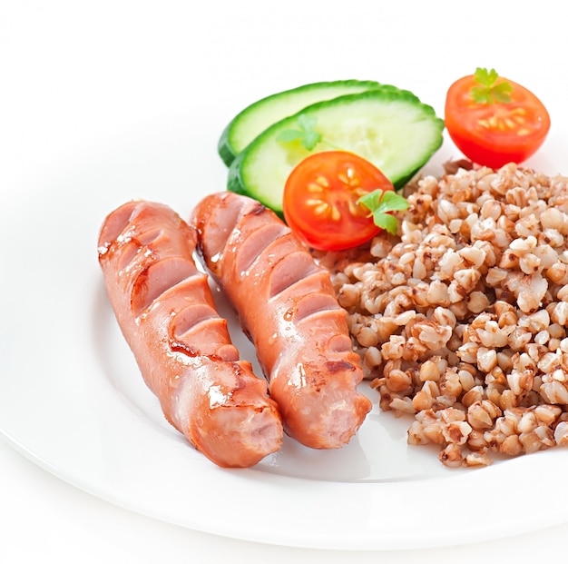 sausages on the grill and salad