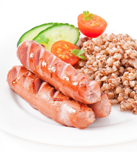 sausages on the grill and salad