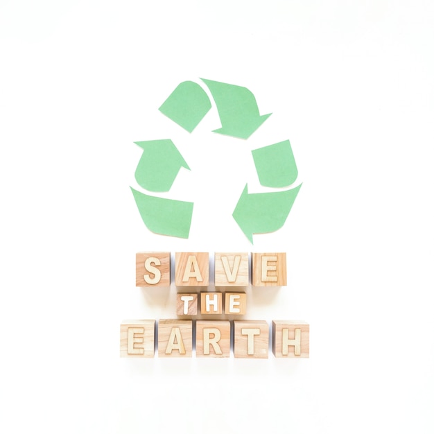 Free photo save the earth inscription and recycle sign