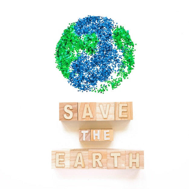 Free photo save the earth words on cubes and planet symbol