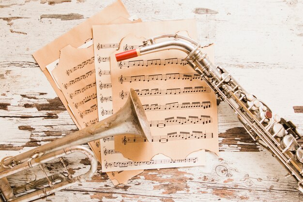 Saxophone and trumpet on sheet music