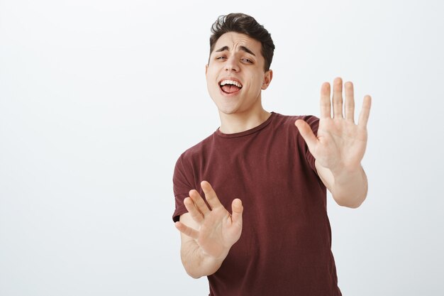 scared funny young guy in red t-shirt