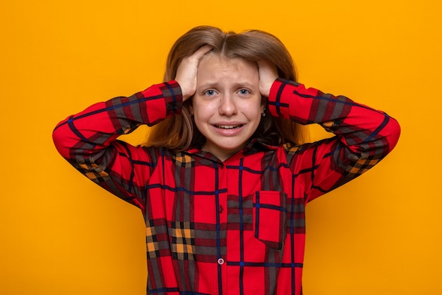 Scared grabbed head beautiful little girl wearing red shirt 