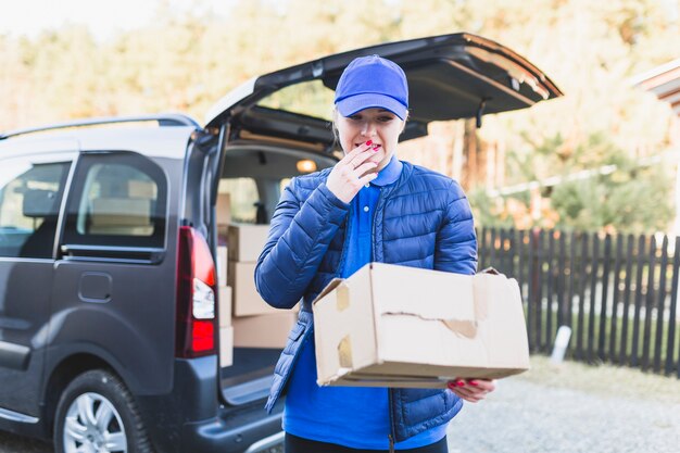 Scared woman delivering damaged box