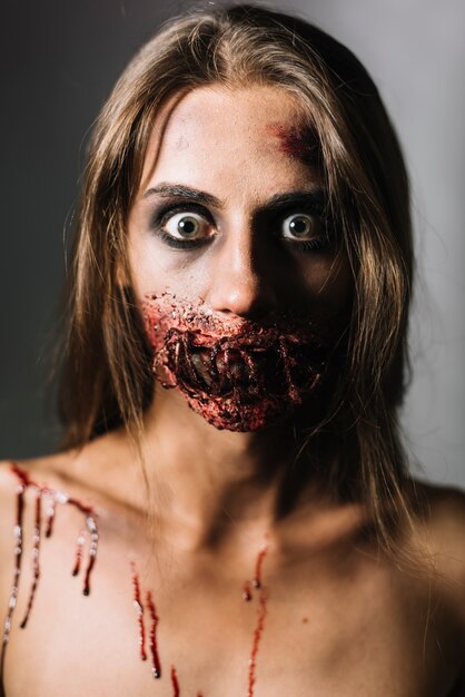 Scared woman with damaged face