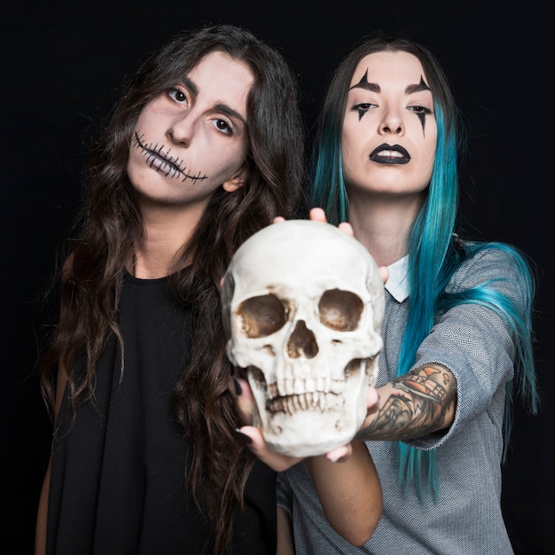 Scary girls with human skull