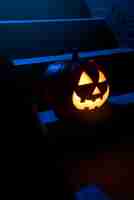 Free photo scary halloween pumpkin on stairs