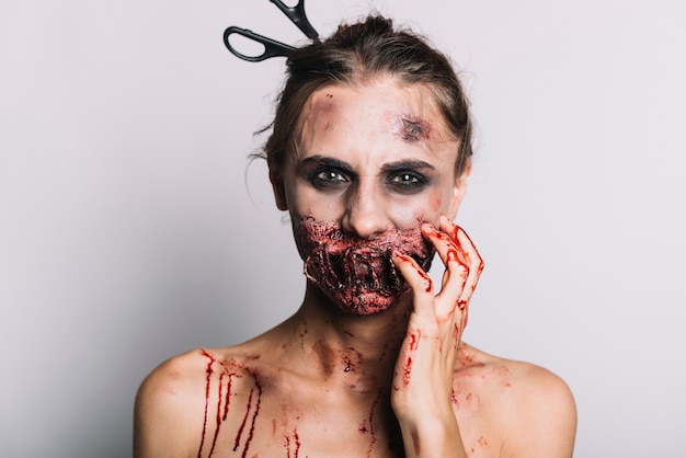 Free photo scary woman with bloody grime