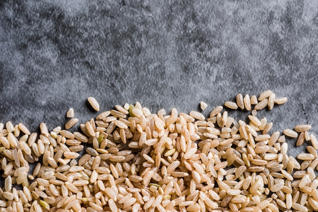 Scattered brown rice on table