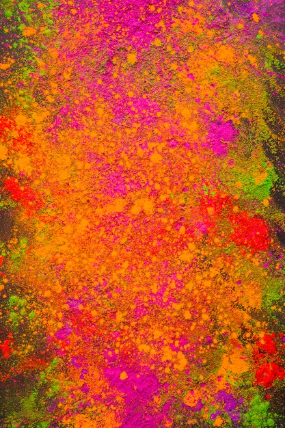 Scattered orange powder on dark table