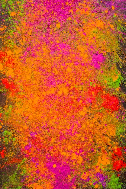 Scattered orange powder on dark table