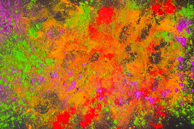 Scattered painted powder on dark table