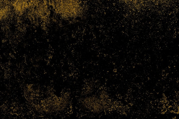 背景の黒いコンクリートの壁の表面に散在する黄色のグランジテクスチャ