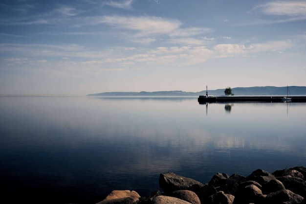 Experience the Tranquil Beauty of the Ocean Shore under a Clear Sky with Free Stock Photos