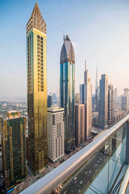 Scenic aerial view on downtown Dubai, United Arab Emirates with skyscrapers and highways. Colourful travel background.