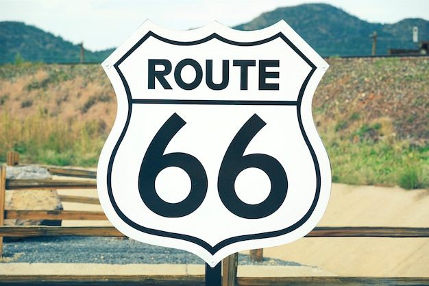 A scenic view of a historic Route 66 sign