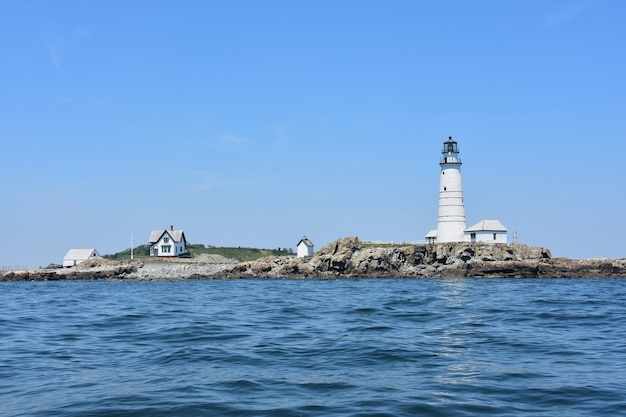Scenic views of Boston Light in the Boston Harbor Islands on a summer day.