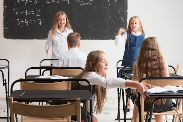 School children in classroom at lesson