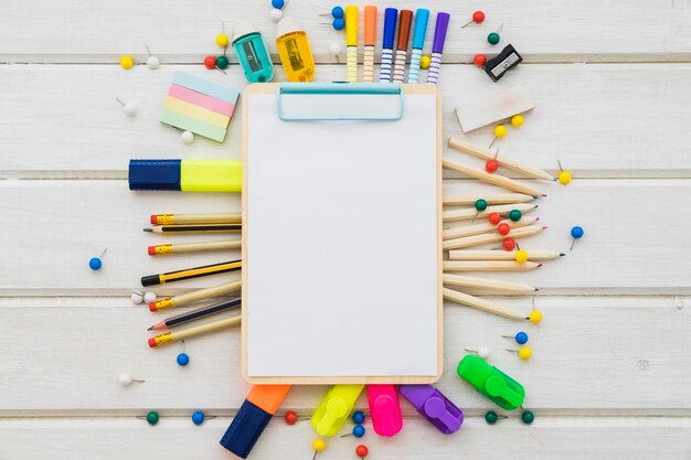 School decoration with clipboard on wooden surface