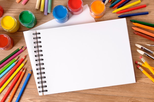 School desk with art notebook