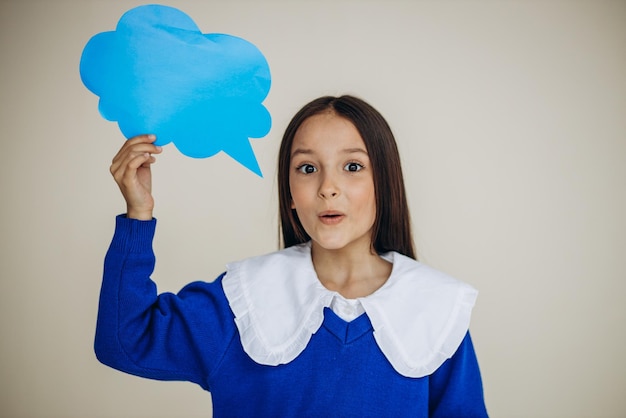 School girl holding speech bubble