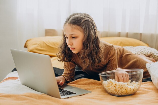 School girl studying at home, distant learning