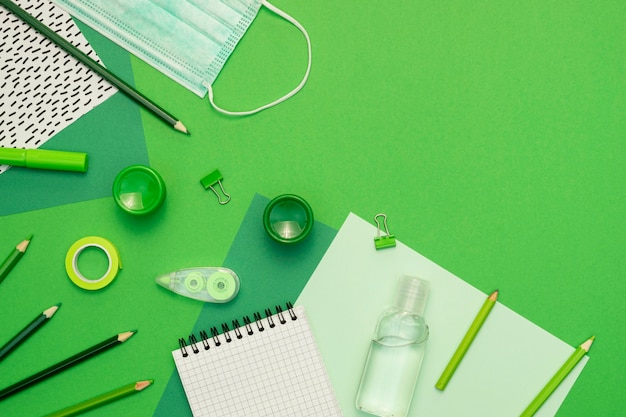 School items on green background