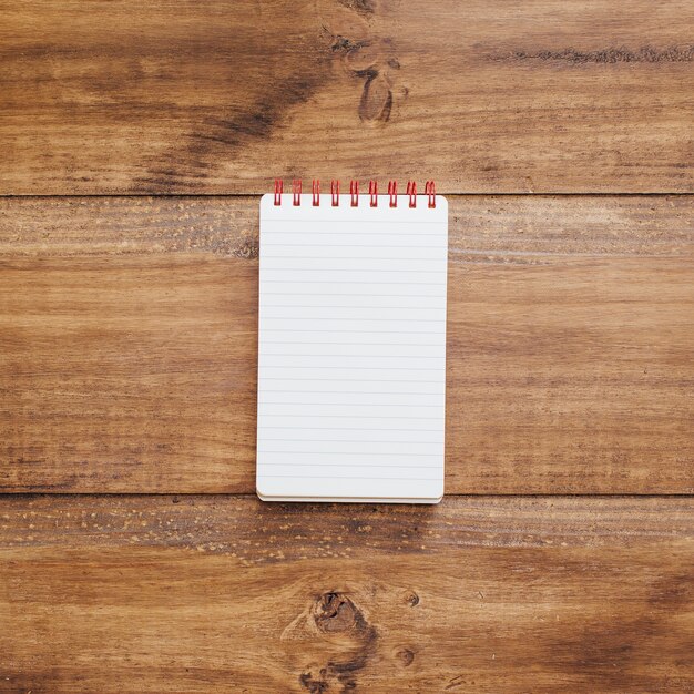 School notebook on a rustic wooden background