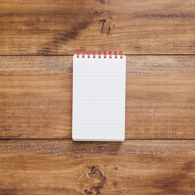 School notebook on a rustic wooden background