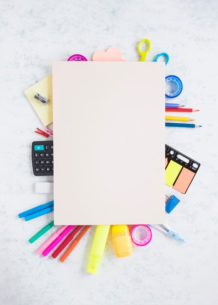 School and office supplies on textured background