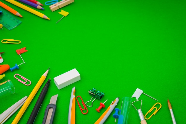 School supplies on Green chalkboard " Back to school background "