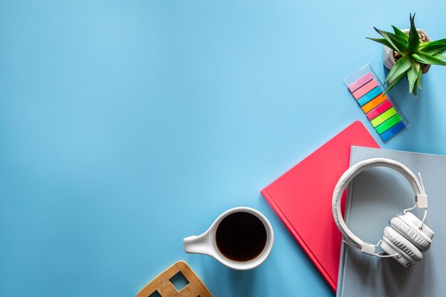 School supplies stationery on a blue background copy space