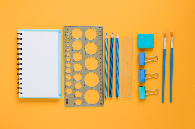 School supplies with blank notebook