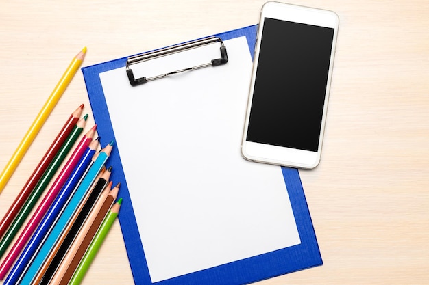 School supplies on wooden background