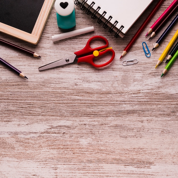 School supplies on wooden surface