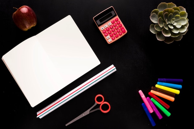 School tools on black table