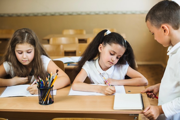 Free photo schoolchildren studying in classroom