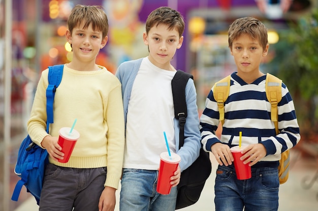 Schoolchildren with backpacks at the mall