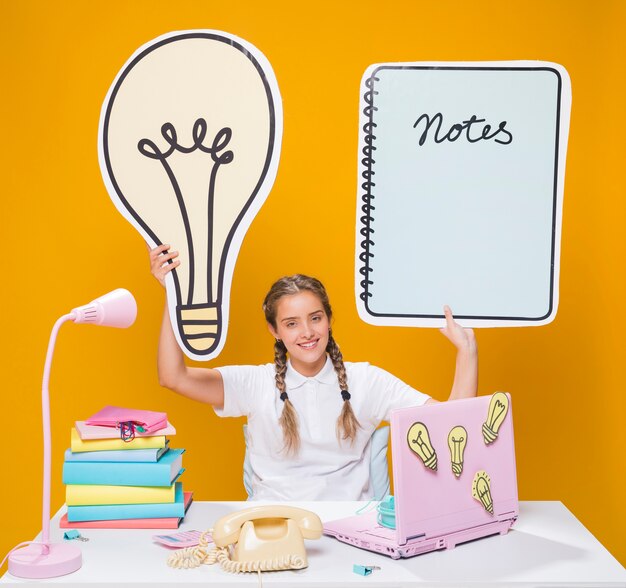 Schoolgirl on desk with laptop in memphis style