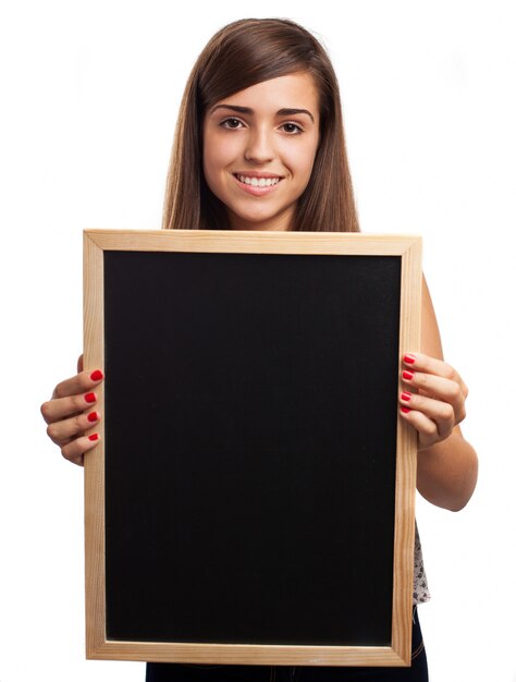 Schoolgirl holding a clean slate