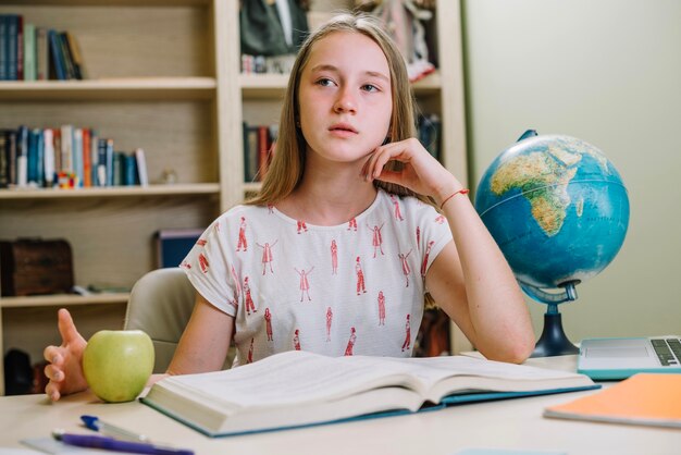 Schoolgirl sitting and thinking