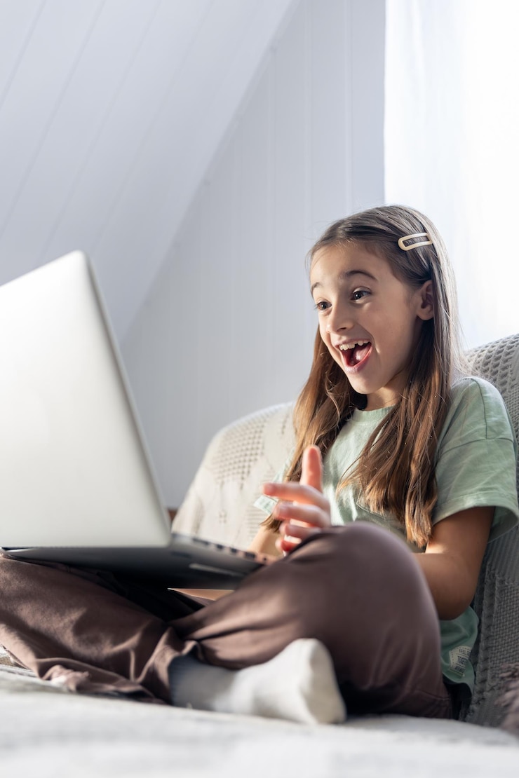 Free Photo a schoolgirl studies online at home school education online