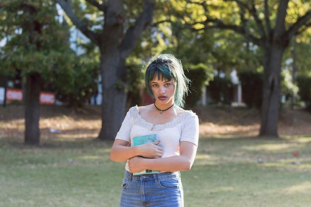 Schoolgirl with book on campus