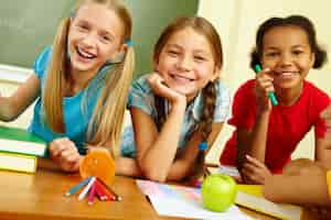 Free photo schoolgirls laughing in class