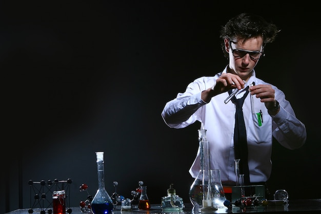 Scientific doing chemical experiment