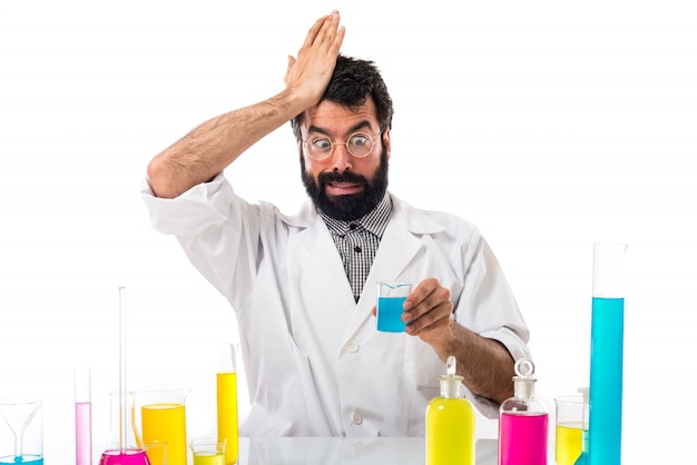 Scientist man doing surprise gesture
