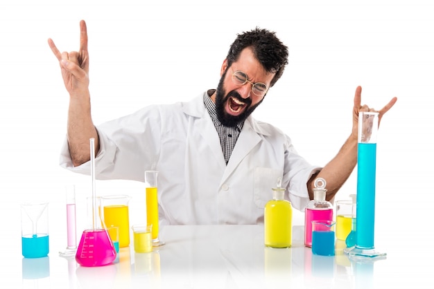 Scientist man making horn gesture