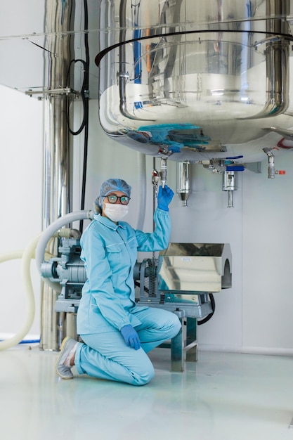 Scientist monitors the readings on the equipment