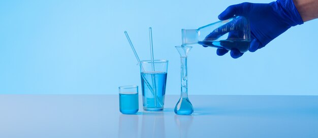 Scientist pouring substance side view