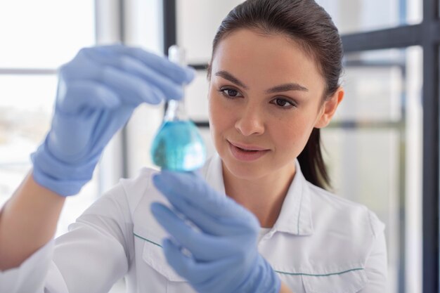 Scientist with chemical substance close up